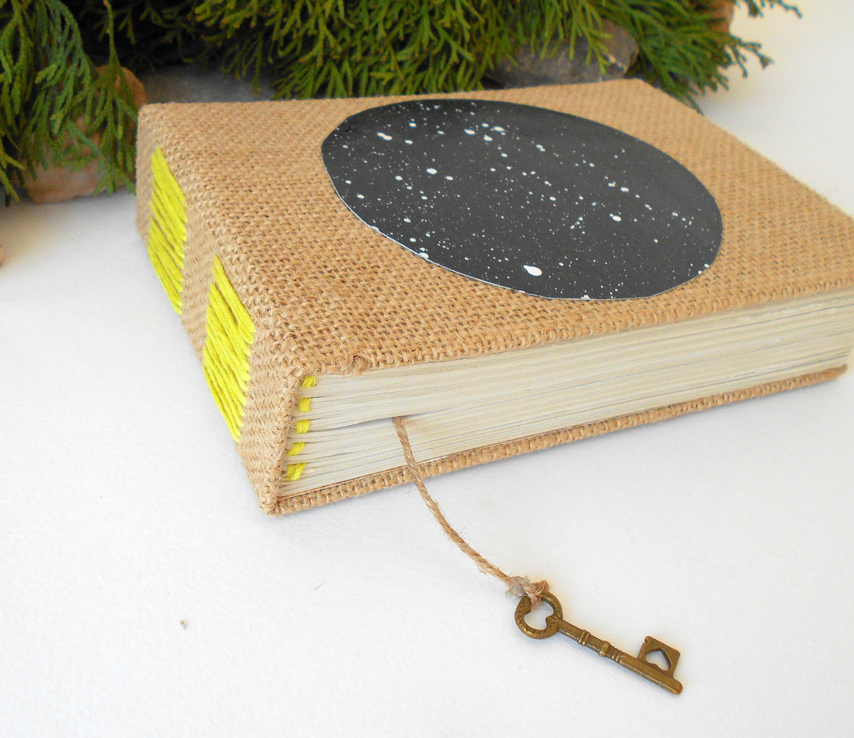 Travel sketchbook with hardcovers and 100% recycled pages and a star sky hand-painted acrylic art circle that I made. It can be used as a wedding book for a rustic wedding.