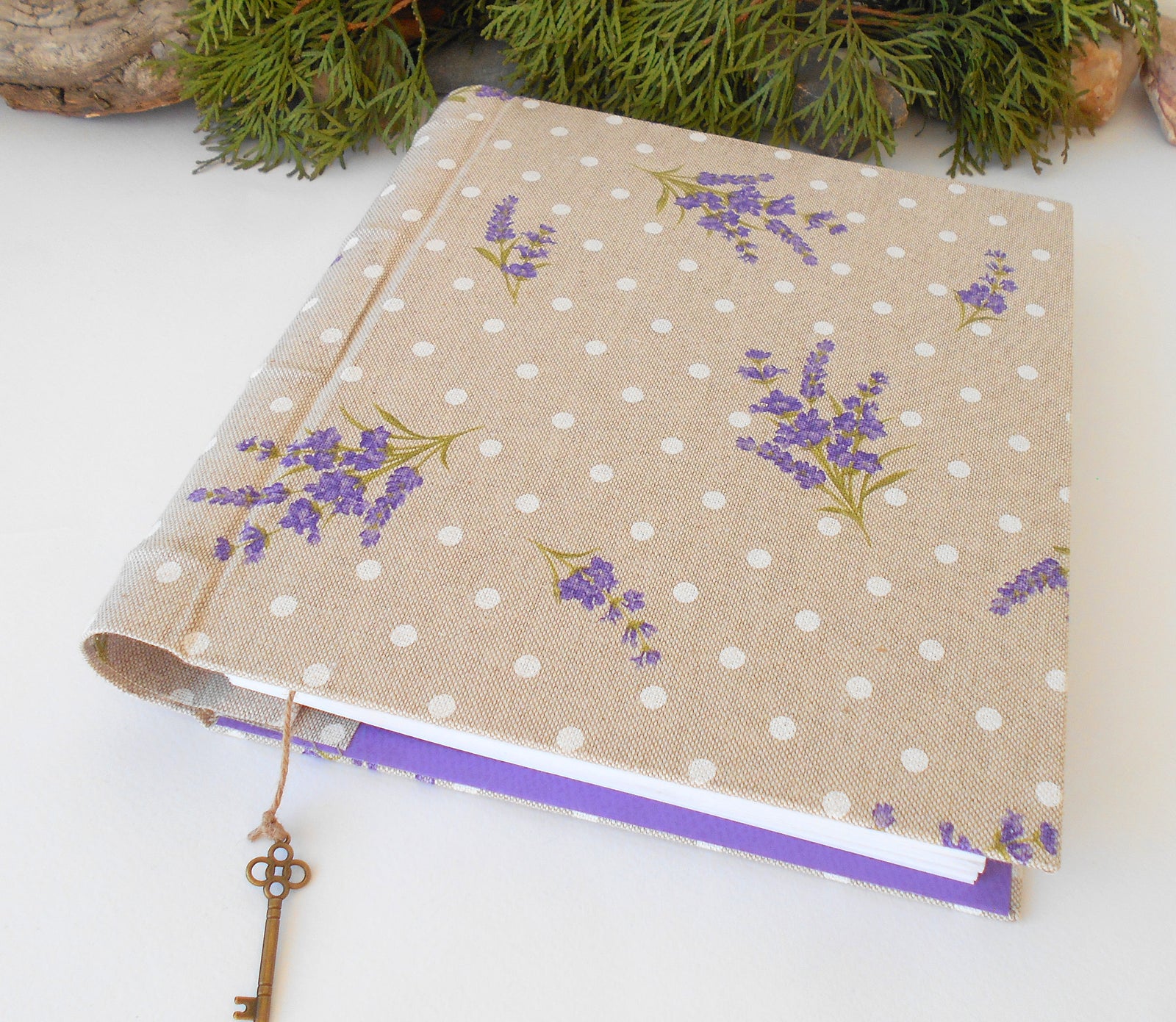 This is a unique personalized travel journal with hardcovers wrapped in a Cotton Lavender fabric covering. This refillable blank journal is made with watercolor card stock that is 105 Lbs. thick ( 250 gsm. ). You can unwrap the twine cord and put new page sheets. when you write off the pages.  On the inside of the front cover, I have crafted also a Lavender fabric pocket where you can put some notes, pictures, or other small objects.