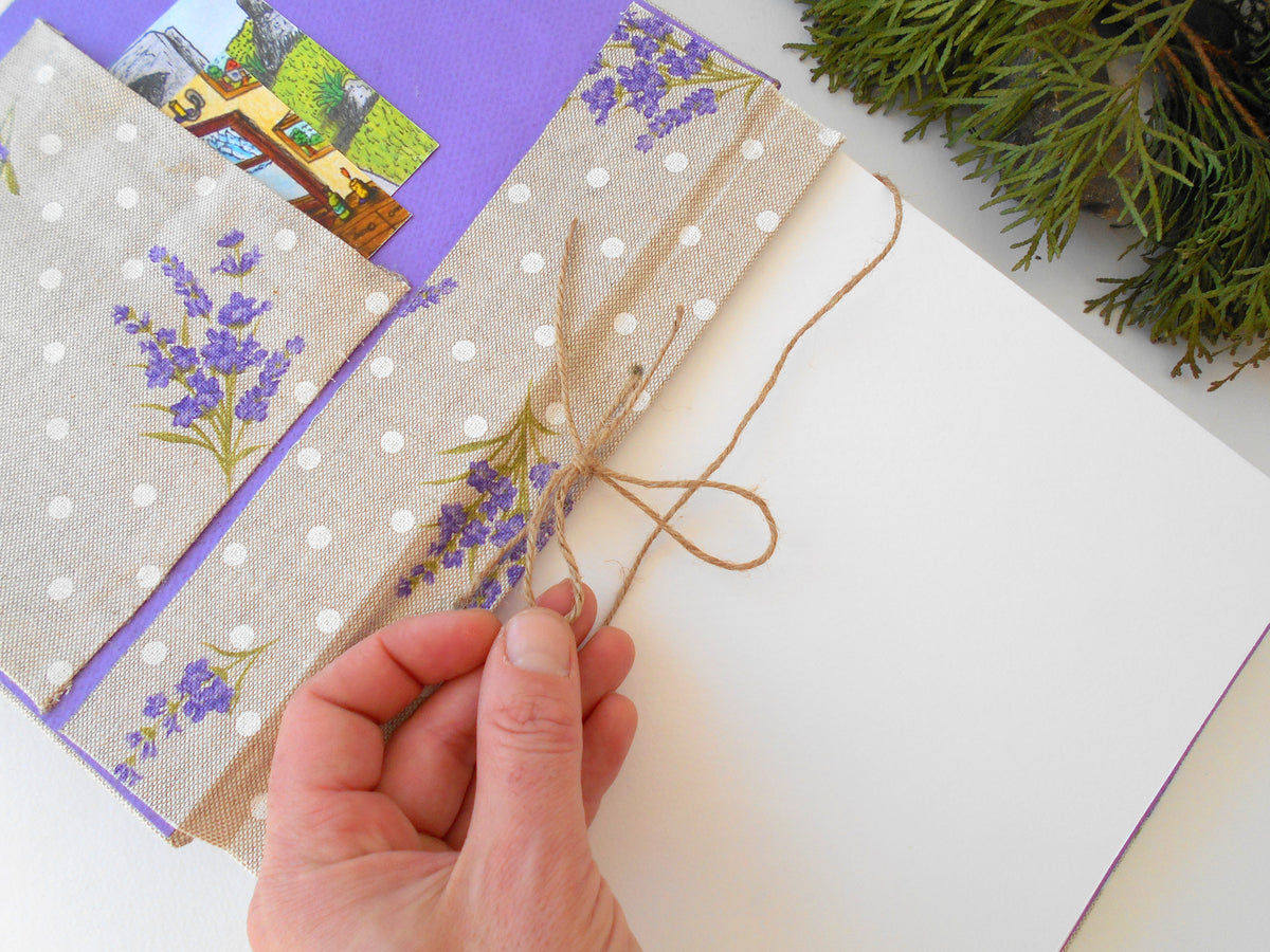 This is a unique personalized travel journal with hardcovers wrapped in a Cotton Lavender fabric covering. This refillable blank journal is made with watercolor card stock that is 105 Lbs. thick ( 250 gsm. ). You can unwrap the twine cord and put new page sheets. when you write off the pages.  On the inside of the front cover, I have crafted also a Lavender fabric pocket where you can put some notes, pictures, or other small objects.