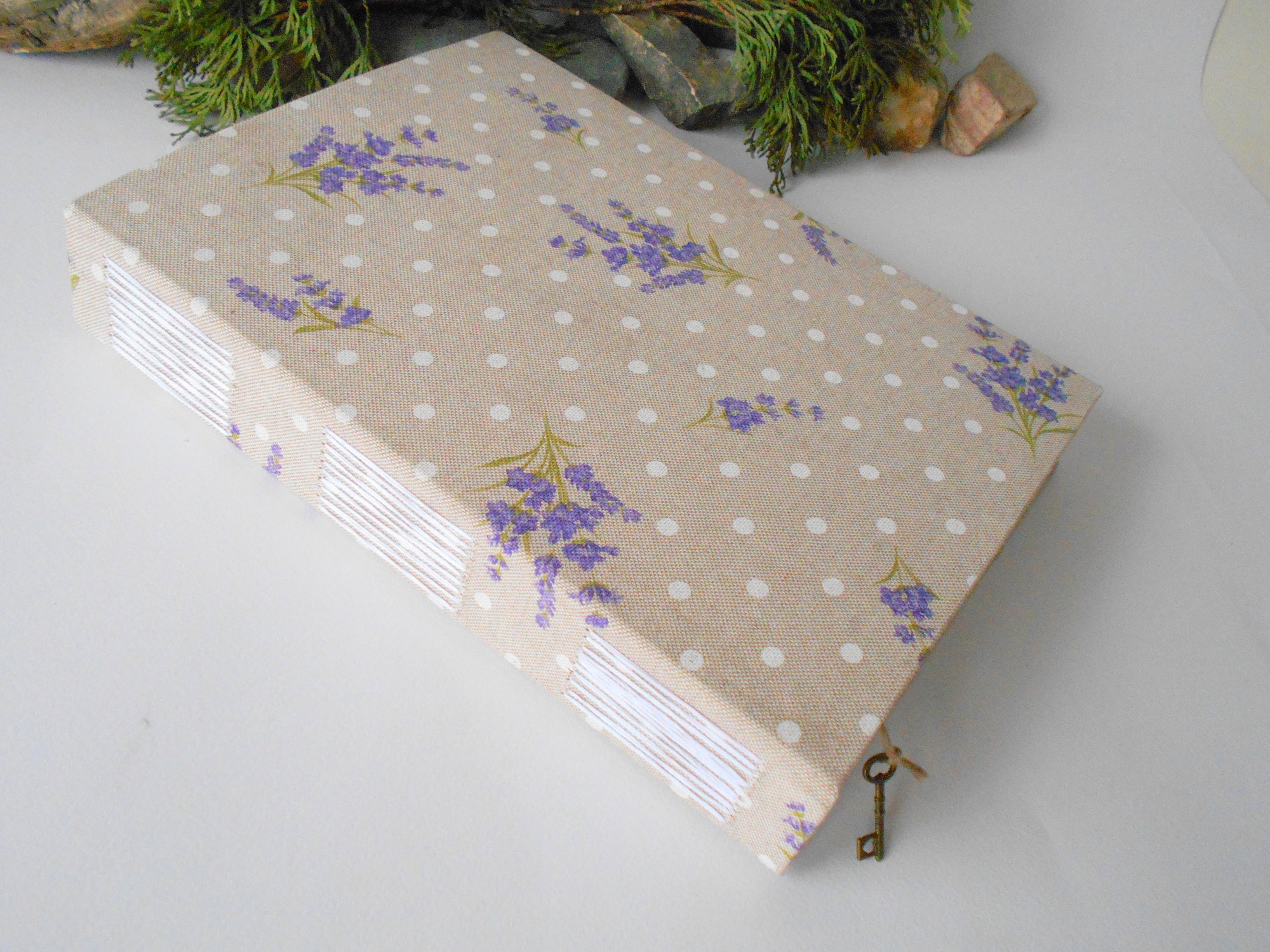 This is a handmade journal with Lavender cotton fabric hardcovers with Long-stitch triple binding that you can personalize in color. 