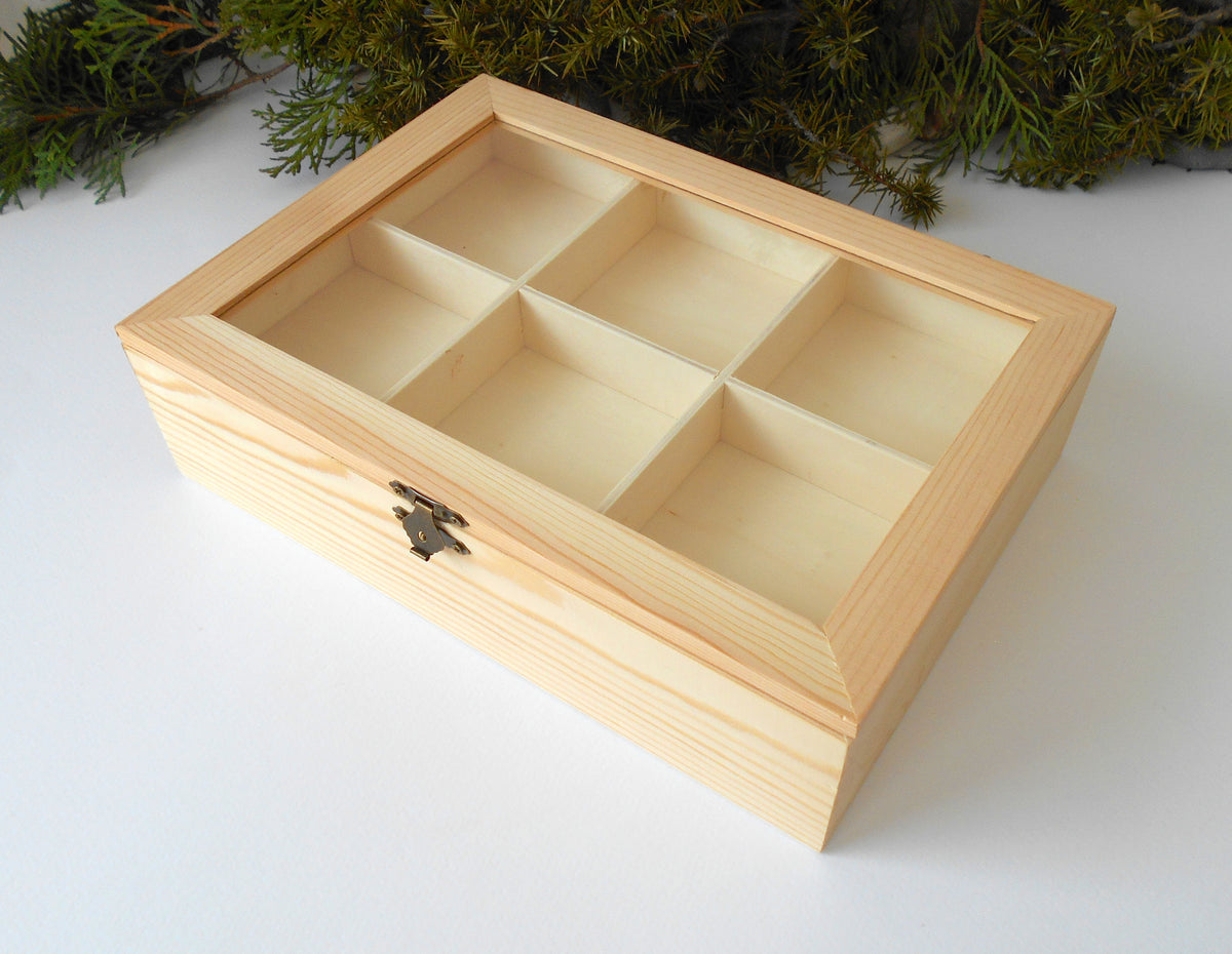 &lt;p&gt;This is a wooden box with a glass display that is made of pinewood and that has metal hinges and closes with a bronze-color closing that may display various things like jewelry, miniatures, crystals, or other small objects of importance to you or your friends.&lt;/p&gt; &lt;p&gt;The box is with 11 compartments on 2 levels- 6 compartments on the top level and 5 compartments on the bottom level.&lt;/p&gt;