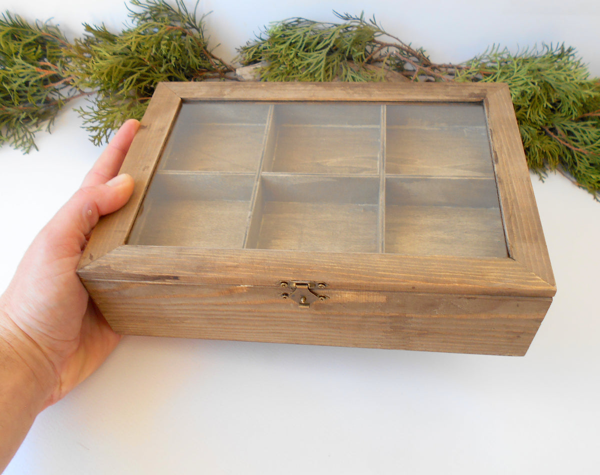 This is a wooden box with a glass display that is made of pinewood and that has metal hinges and closes with a bronze-color closing that may display various things like jewelry, miniatures, crystals, or other small objects of importance to you or your friends. &lt;span&gt;I have colored the box with mordant so that it looks like an old wood vintage box with a mahogany color.&lt;/span&gt;