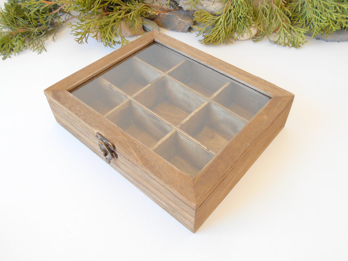 This is a wooden box with a glass display that is made of bamboo wood and that has metal hinges and closes with a bronze-color closing that may display various things like jewelry, miniatures, crystals, or other small objects of importance to you or your friends. &lt;span data-mce-fragment=&quot;1&quot;&gt;I have colored the box with mordant so that it looks like an old wood vintage box with a mahogany color.&lt;/span&gt;