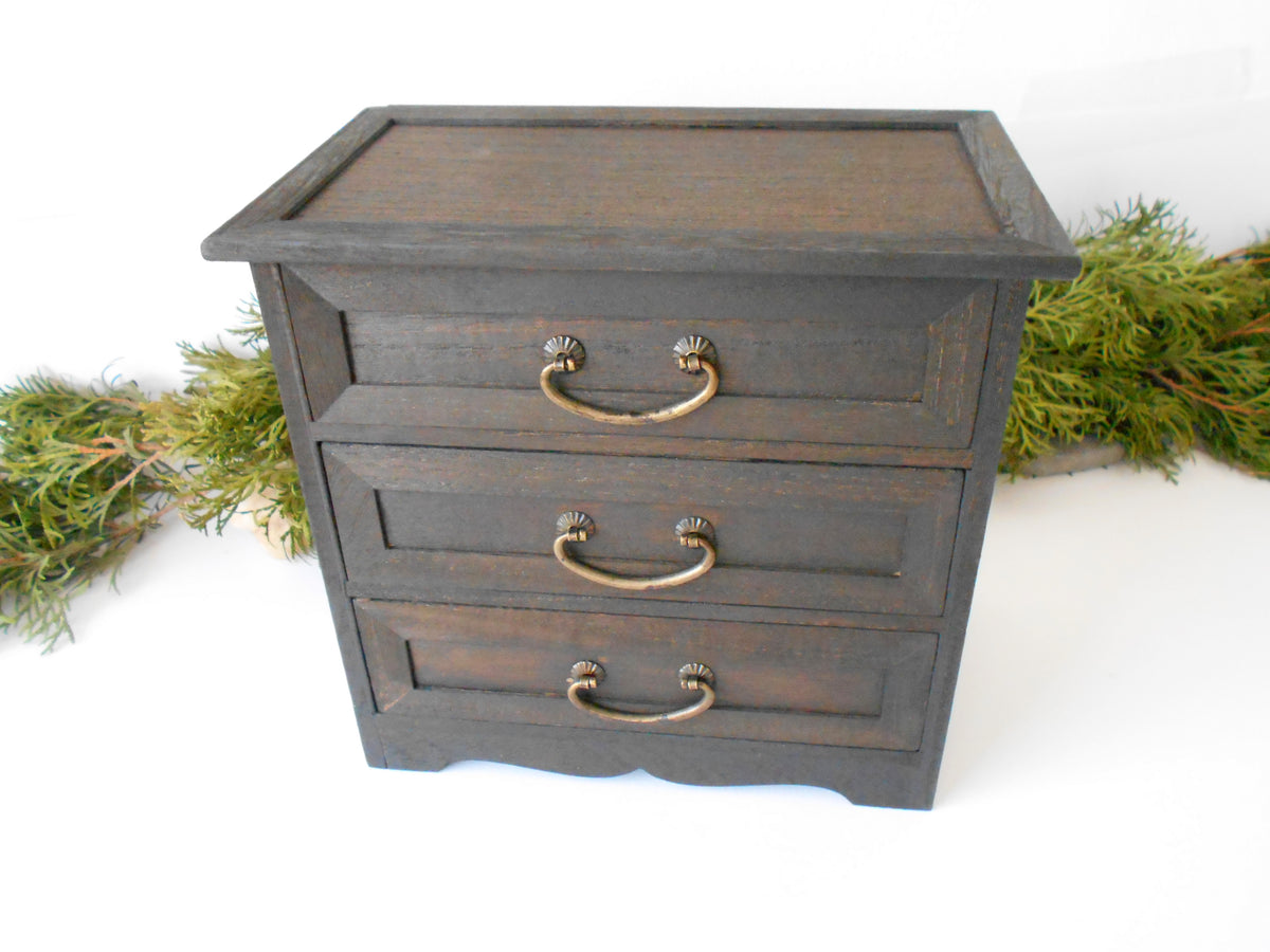 This wooden box with 3 drawers is made of bamboo wood. It has metal pulls with a vintage bronze color. The surface of the box is smooth and refined with sanding paper.&amp;nbsp;