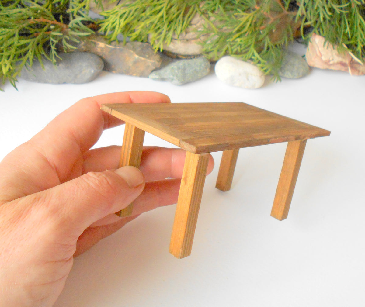 This is a handmade miniature dining or kitchen table on a&amp;nbsp;&lt;span data-mce-fragment=&quot;1&quot;&gt;1/12&lt;/span&gt;&lt;span data-mce-fragment=&quot;1&quot;&gt;th&lt;/span&gt; scale that is suitable for 6 mini chairs on a 1/12th scale. I handmade this table on order with real pine wood boards and beams and with water-based eco-friendly glue. I have stained that table with Italian eco-friendly mordant in light brown.