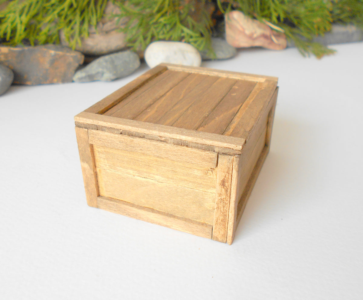 This is a miniature transporting box coffer that is approximately 1/12 in scale. The box coffer has 3 wooden boards in height and four boards in width on each side.&lt;br data-mce-fragment=&quot;1&quot;&gt;This is a listing to purchase one such miniature box like the one you see from the pictures. I have stained the box in light brown with an Italian eco-friendly mordant.&amp;nbsp;