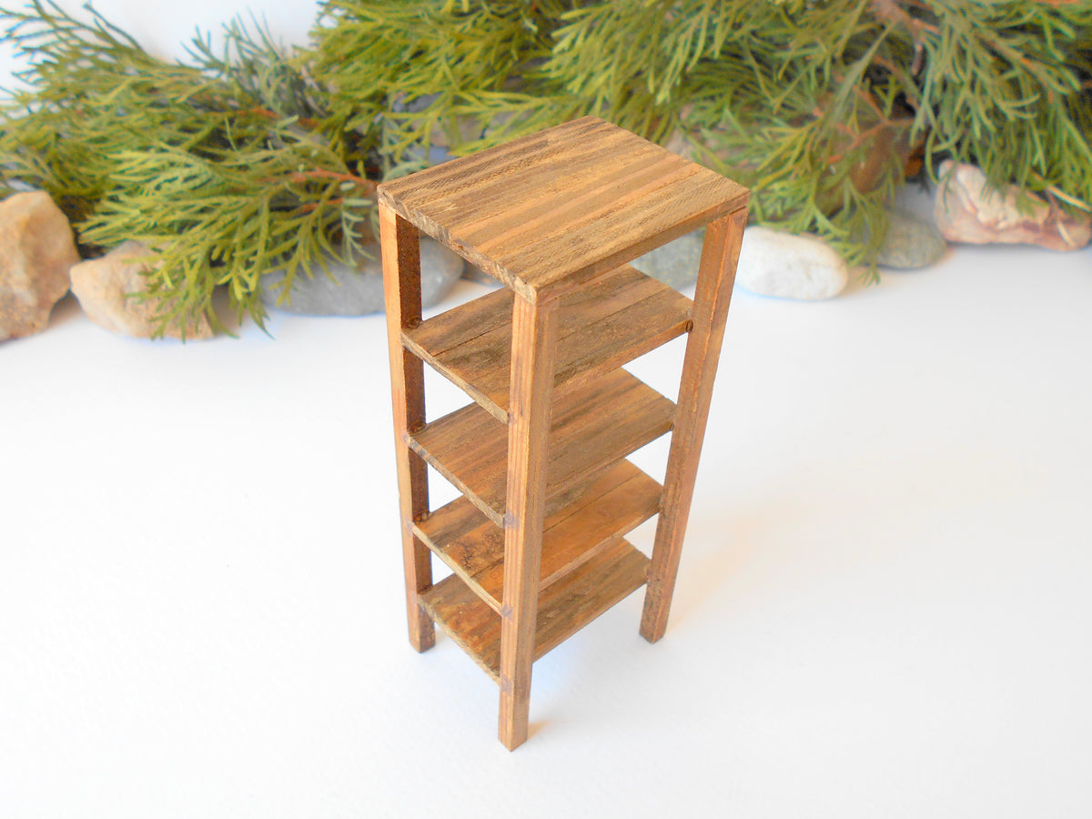 This is a Miniature shelf of wooden furniture that is approximately 1/12 in scale. I have stained the shelf with light brown Italian eco-friendly mordant.&amp;nbsp;