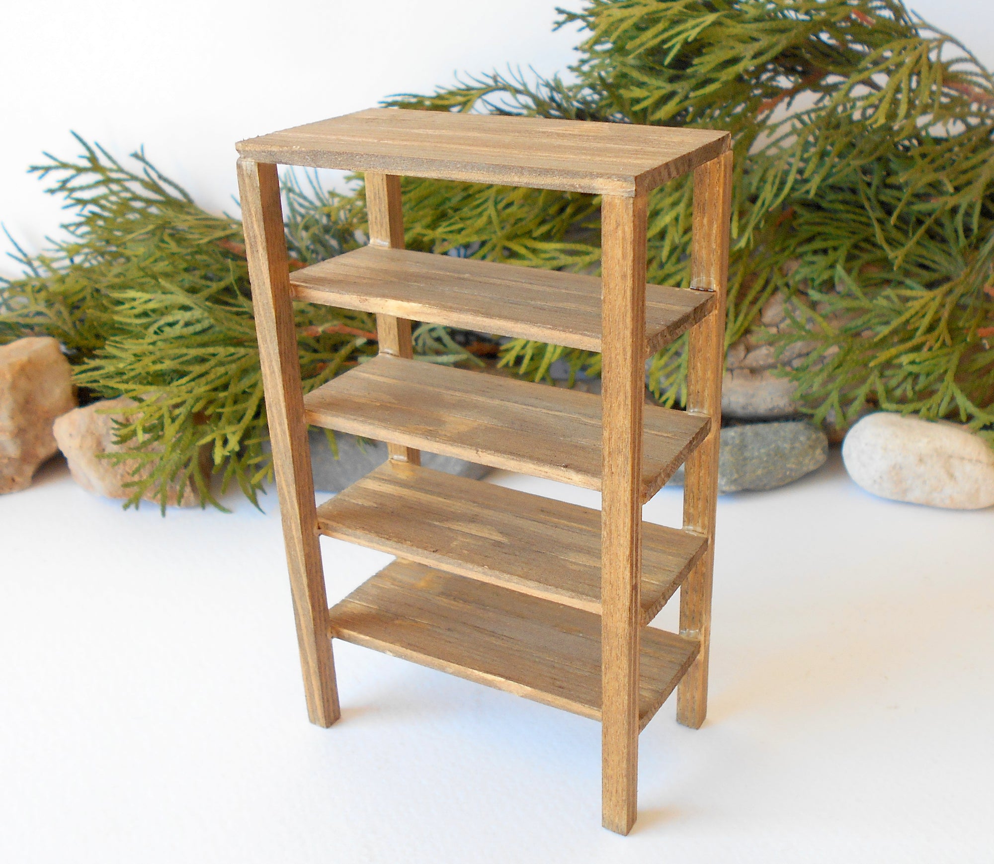 This is a Miniature shelf of wooden furniture that is approximately 1/12 in scale<strong>. </strong>I have stained the shelf with light brown Italian eco-friendly mordant.&nbsp;