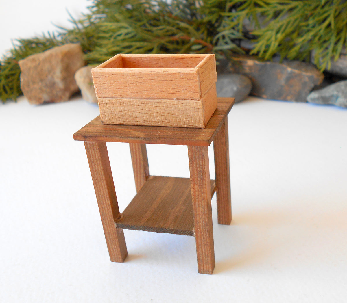 This is a Miniature nightstand or plant stand table of wooden furniture that is approximately 1/12 in scale. I have stained the mini nightstand with an Italian eco-friendly mordant in light brown.