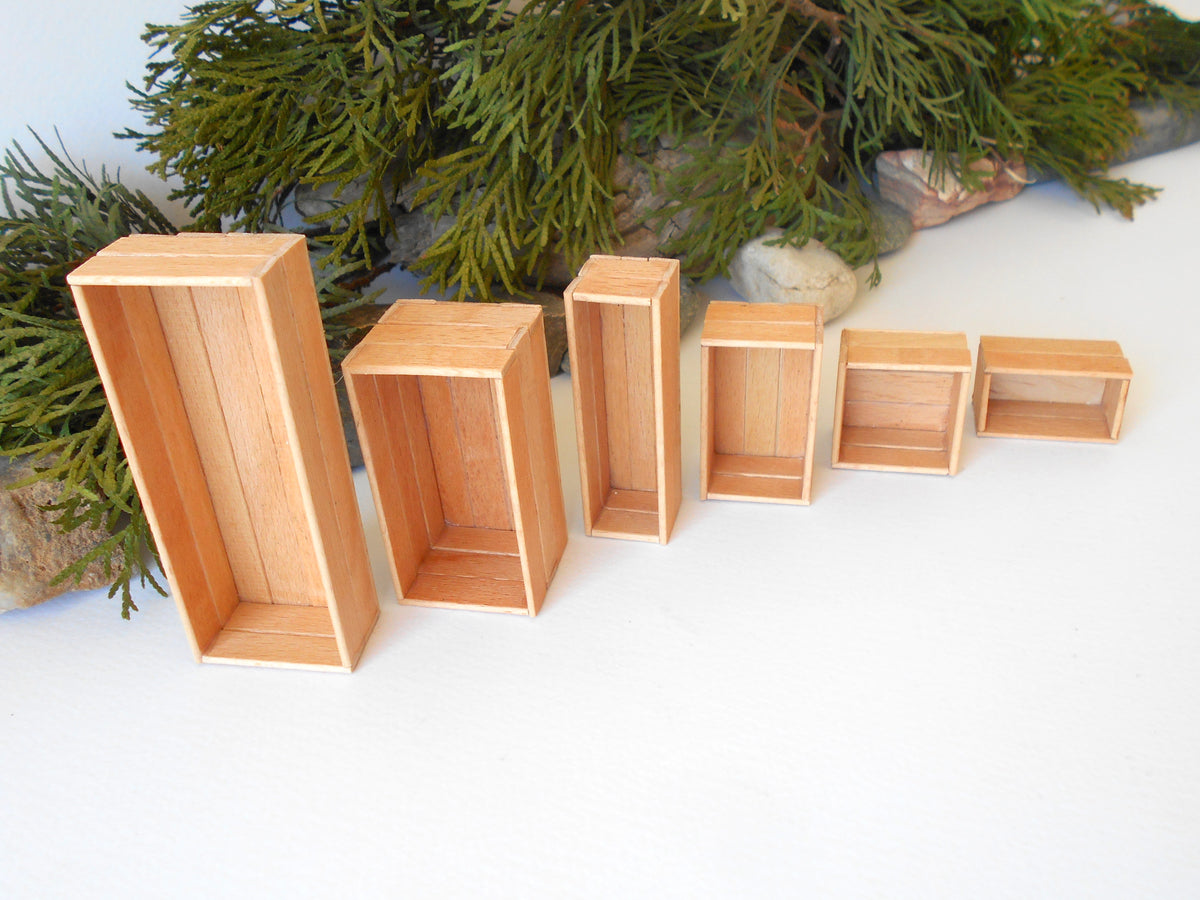 This is a set of 6 miniature boxes that are in 1/12 in scale. I craft them on order from beech popsicle sticks that I saved from being thrown away when I worked in an Ice cream factory in the Netherlands in 2023. The set consists of 6 different boxes. Read below for sizes.