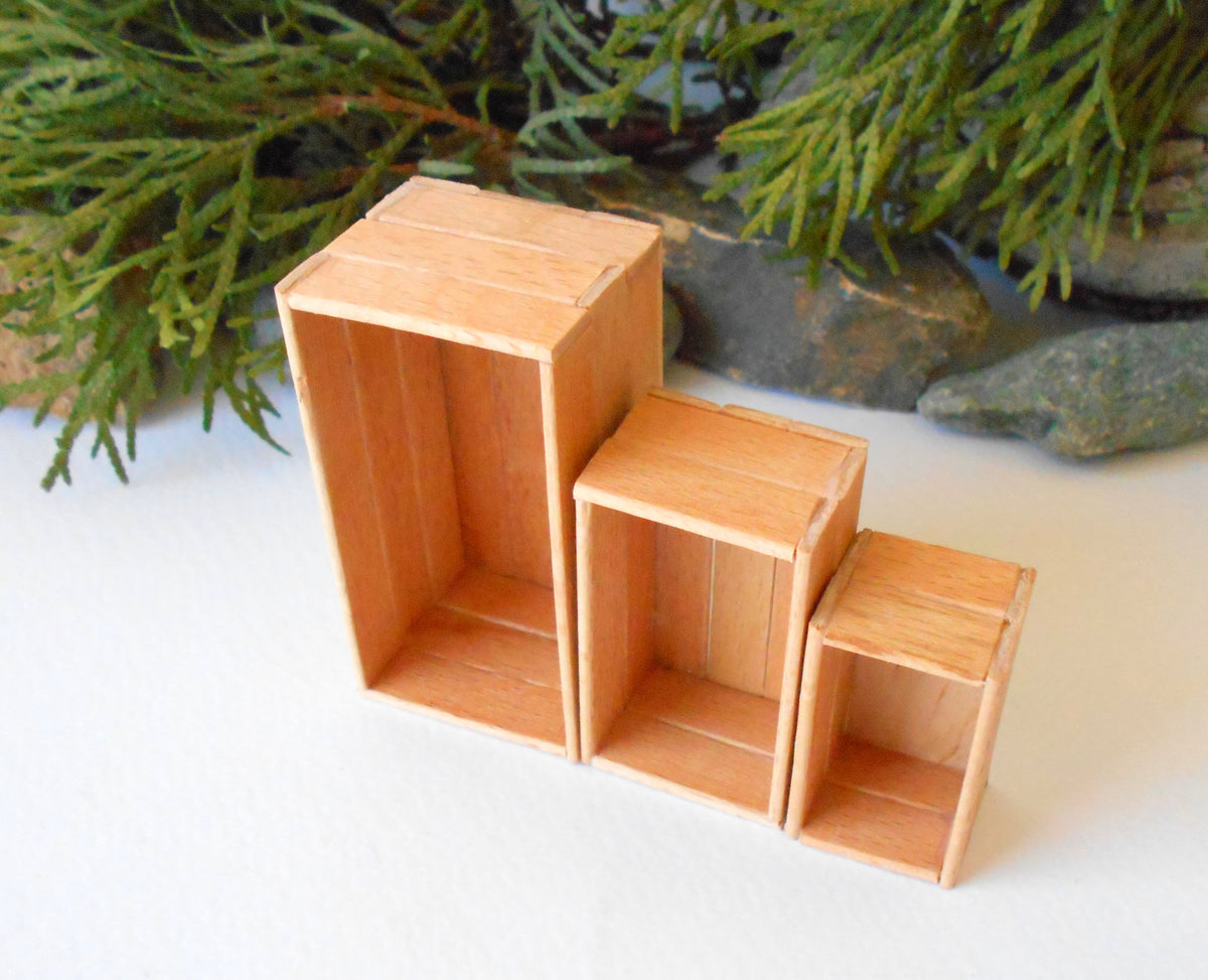 This is a set of 3 miniature boxes that are in 1/12 in scale. I craft them on order from beech popsicle sticks that I saved from being thrown away when I worked in an Ice cream factory in the Netherlands in 2023. The set consists of 1 big rectangular box, 1&amp;nbsp; medium rectangular box, and one small rectangular box.