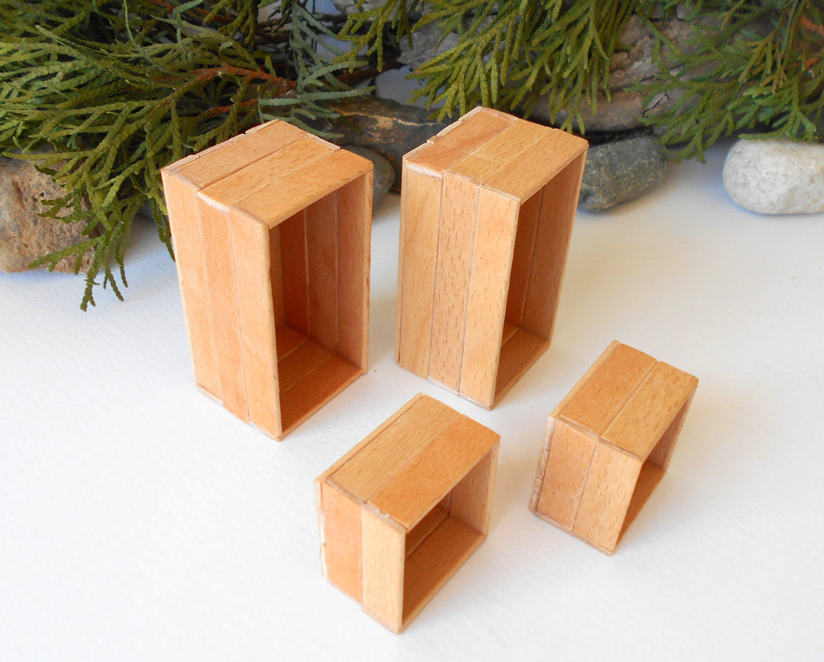 This is a set of 4 miniature boxes that are in 1/12 in scale. I craft them on order from beech popsicle sticks that I saved from being thrown away when I worked in an Ice cream factory in the Netherlands in 2023.