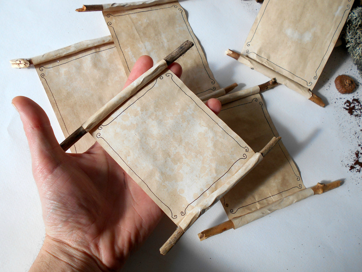 Handmade blank paper scrolls with coffee recycled papers and hand-drawn templates on the edges