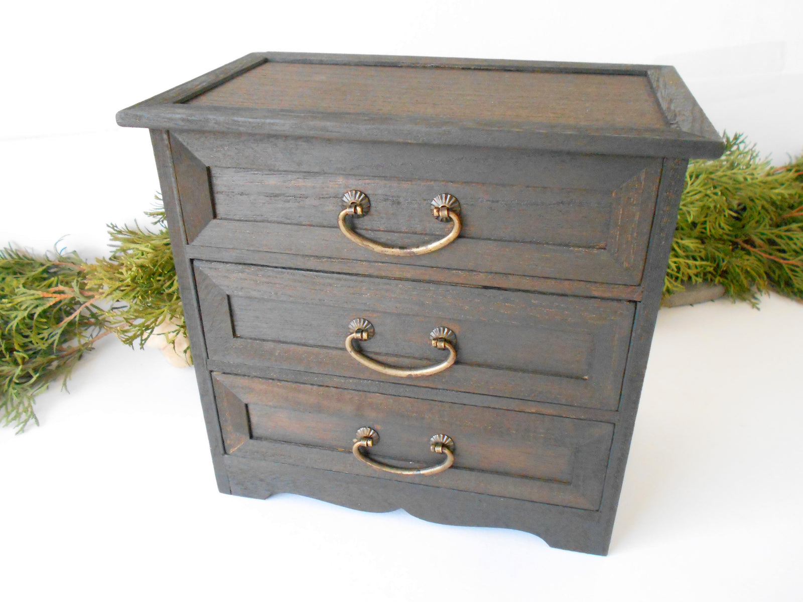 This wooden box with 3 drawers is made of bamboo wood. It has metal pulls with a vintage bronze color. The surface of the box is smooth and refined with sanding paper.&nbsp;