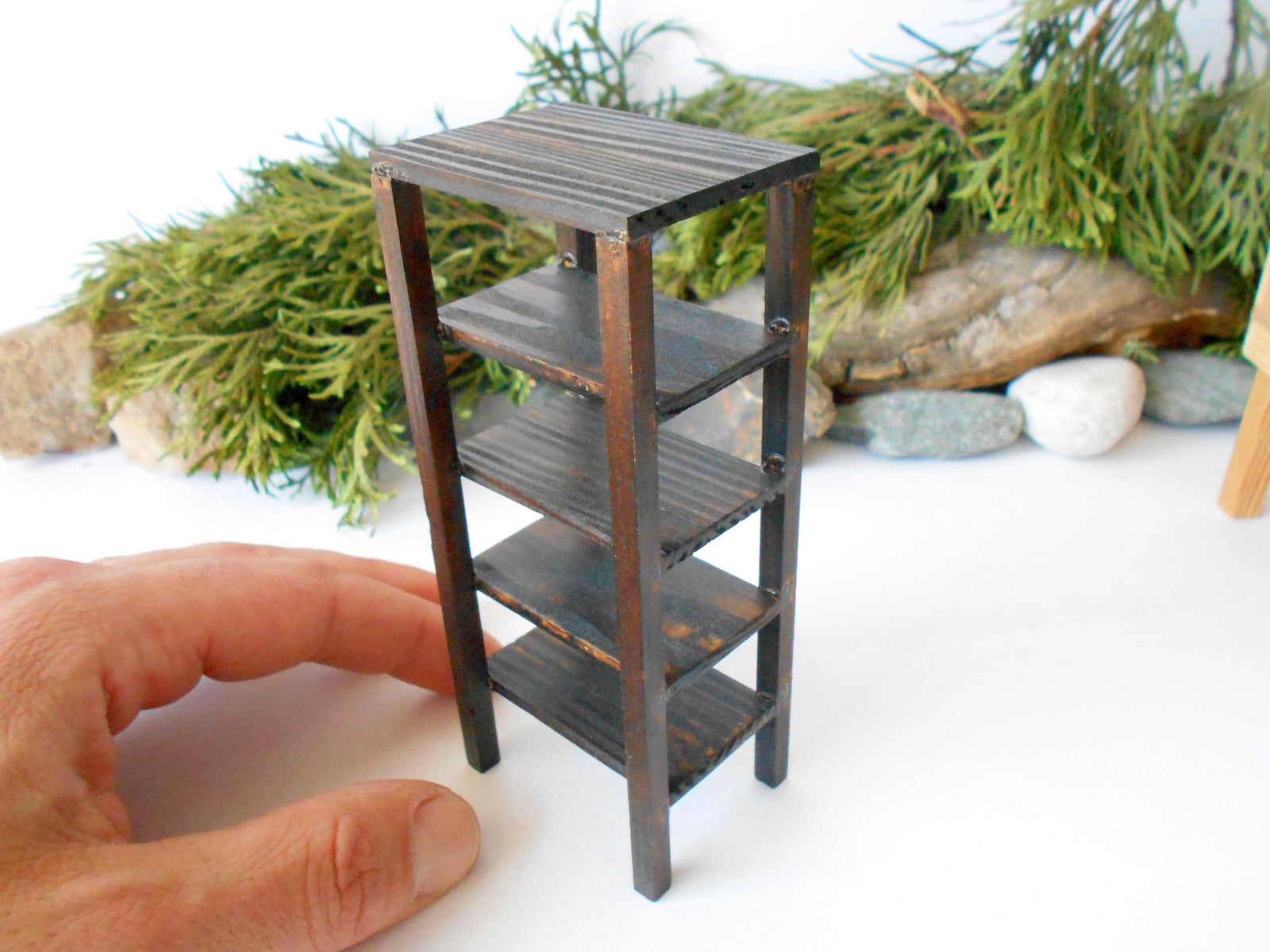 This is a Miniature shelf of wooden furniture that is approximately 1/12 in scale. I have stained the shelf with dark brown Italian eco-friendly mordant.&nbsp;  This is a listing to purchase one such shelf like the one you see in the pictures. This mini&nbsp;rack is crafted with eco-friendly glue and&nbsp;pine wood fine and smoothed sticks.