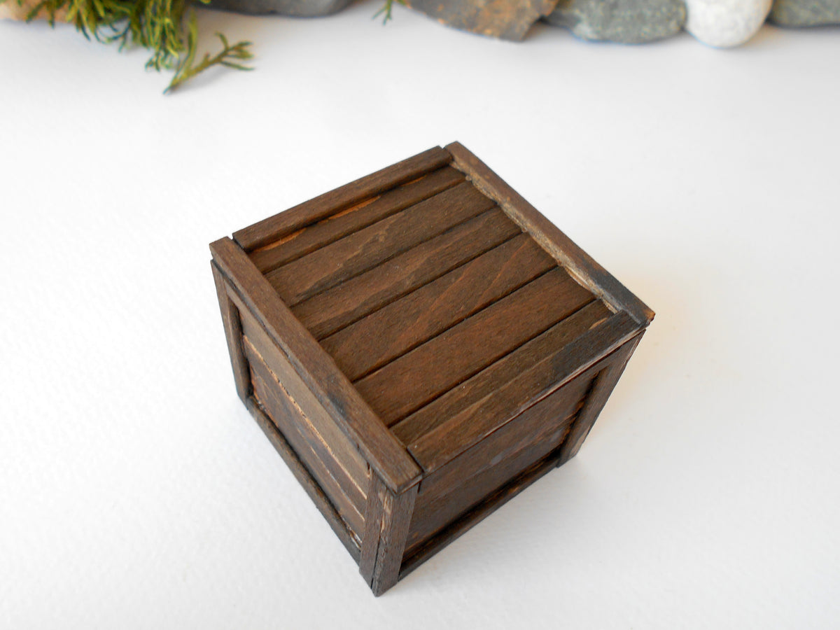 This is a miniature transporting box coffer that is approximately 1/12 in scale. The box coffer I have crafted from reclaimed beech wood popsicle sticks that I saved from the landfill.
