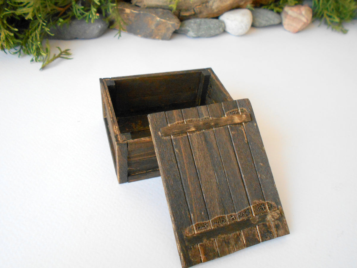 This is a miniature transporting box coffer that is approximately 1/12 in scale. The box coffer has 3 wooden boards in height and four boards in width on each side. This is a listing to purchase one such miniature box like the one you see from the pictures. I have stained the box in dark brown with an Italian eco-friendly mordant.&amp;nbsp;