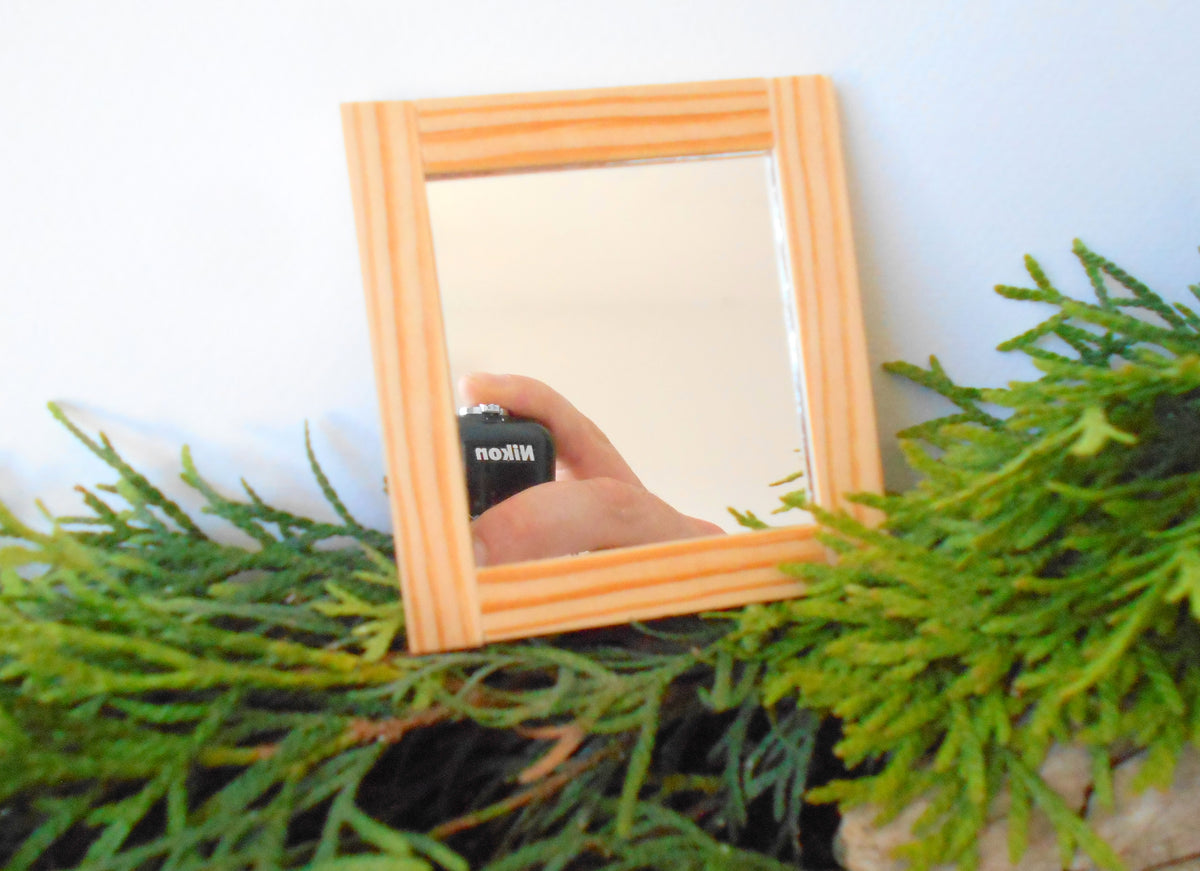 This is a miniature mirror framed with real pinewood that can decorate your dollhouse projects or your architectural models. If you know a passionate collector of miniatures you can make him or her a gift with one tiny framed mirror from an independent artist.  1/12th scale.  Size: 27&#39;&#39; x 2.9&#39;&#39;- 7 x&amp;nbsp; 7.5 cm.  Thickness: 0.15&#39;&#39; which is 0.4 cm.