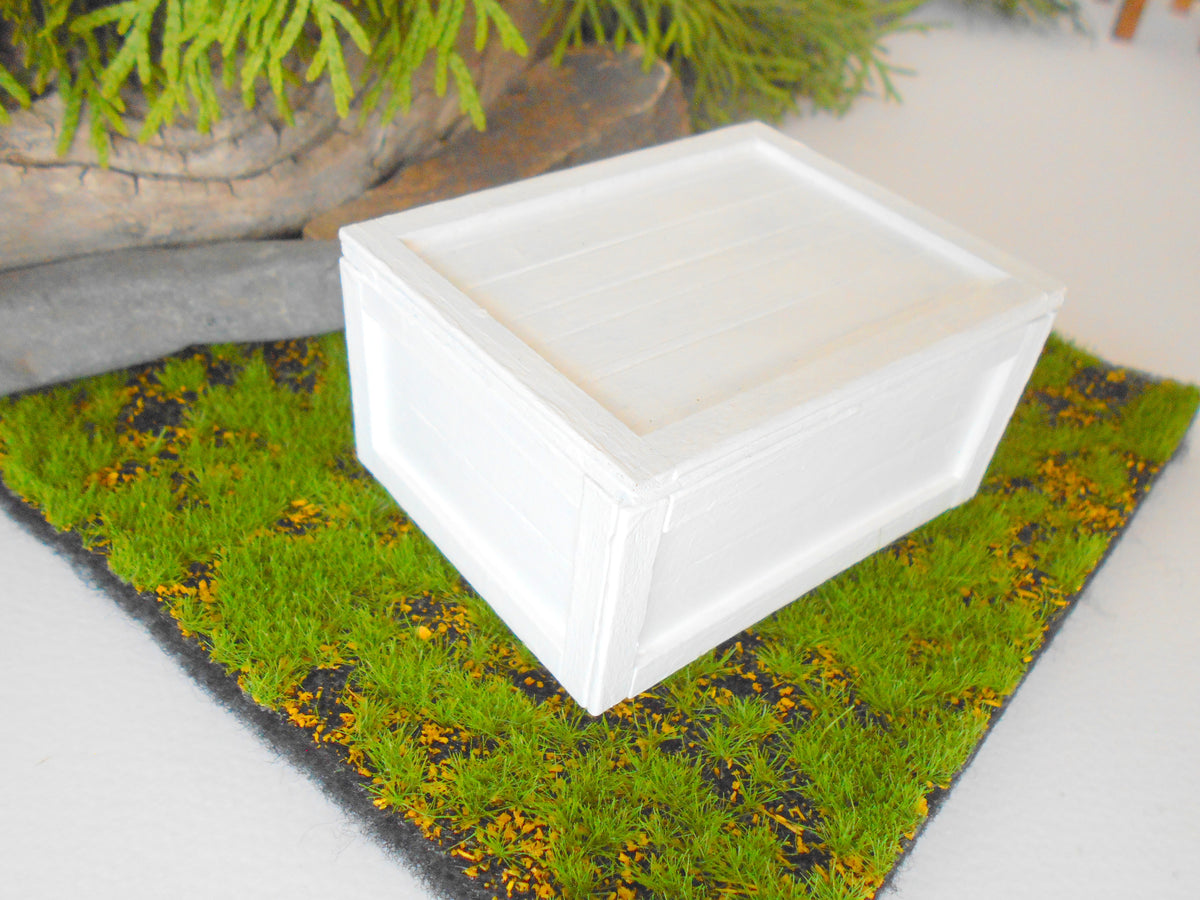 This is a miniature transporting box coffer that is approximately 1/12 in scale. The box coffer has 3 wooden boards in height and four boards in width on each side. This is a listing to purchase one such miniature box like the one you see from the pictures. I have painted the box in white with acrylic paint.&amp;nbsp;