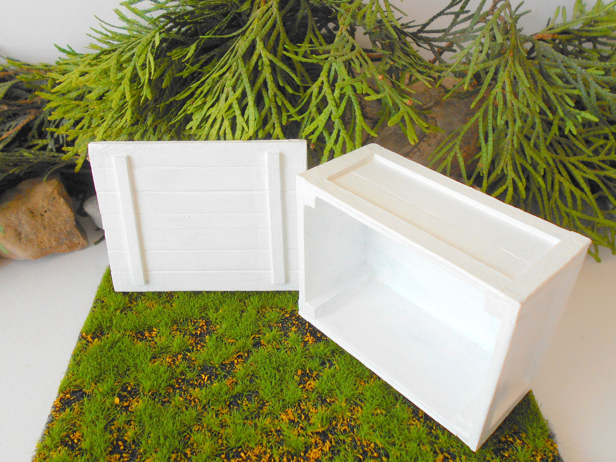 This is a miniature transporting box coffer that is approximately 1/12 in scale. The box coffer has 3 wooden boards in height and four boards in width on each side. This is a listing to purchase one such miniature box like the one you see from the pictures. I have painted the box in white with acrylic paint.&amp;nbsp;