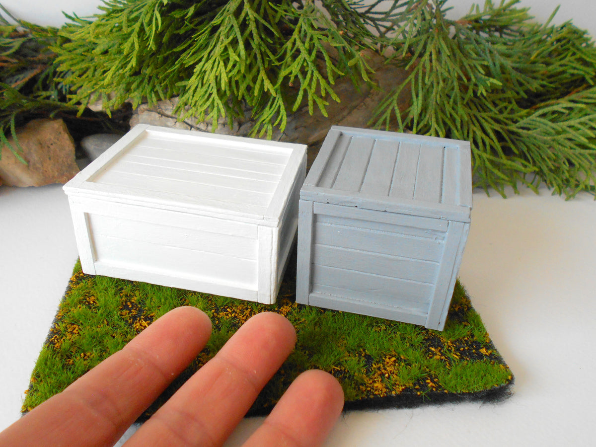 This is a miniature transporting box coffer that is approximately 1/12 in scale. The box coffer has 3 wooden boards in height and four boards in width on each side. This is a listing to purchase one such miniature box like the one you see from the pictures. I have painted the box in white with acrylic paint.&amp;nbsp;