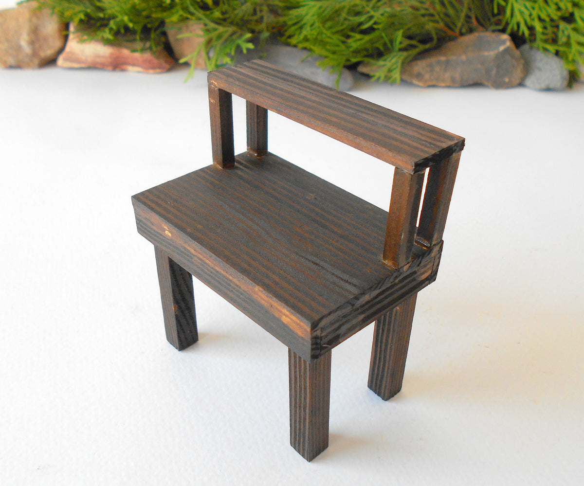 This is a handmade miniature wooden gardening table for miniature dollhouse conservatories on a 1/12th scale. I handmade this table on order with real pine wood boards and beams and with water-based eco-friendly glue. The table has mini shelving on the top desk to have more space for mini planters or mini gardening tools.