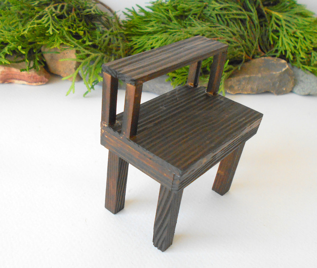 This is a handmade miniature wooden gardening table for miniature dollhouse conservatories on a 1/12th scale. I handmade this table on order with real pine wood boards and beams and with water-based eco-friendly glue. The table has mini shelving on the top desk to have more space for mini planters or mini gardening tools.