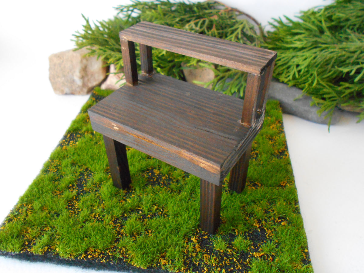 This is a handmade miniature wooden gardening table for miniature dollhouse conservatories on a 1/12th scale. I handmade this table on order with real pine wood boards and beams and with water-based eco-friendly glue. The table has mini shelving on the top desk to have more space for mini planters or mini gardening tools.