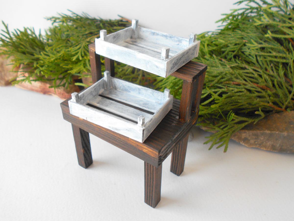 This is a handmade miniature wooden gardening table for miniature dollhouse conservatories on a 1/12th scale. I handmade this table on order with real pine wood boards and beams and with water-based eco-friendly glue. The table has mini shelving on the top desk to have more space for mini planters or mini gardening tools.