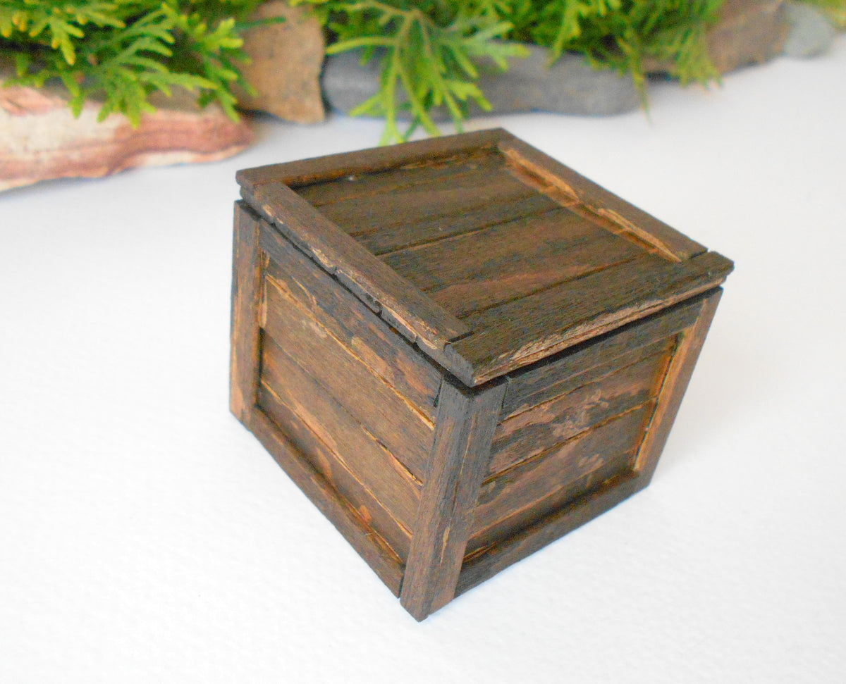 This is a miniature transporting box coffer that is approximately 1/12 in scale. The box coffer I have crafted from reclaimed beech wood popsicle sticks that I saved from the landfill.