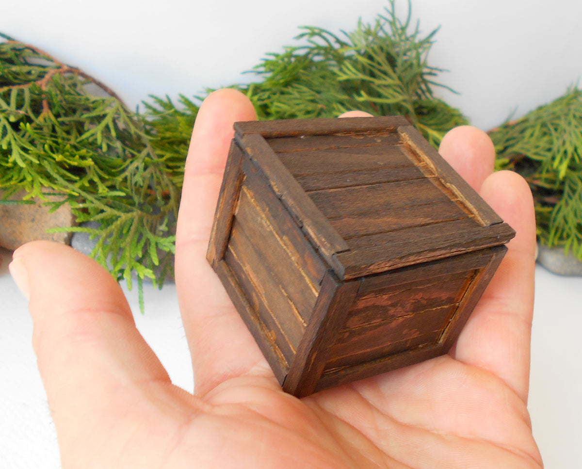 This is a miniature transporting box coffer that is approximately 1/12 in scale. The box coffer I have crafted from reclaimed beech wood popsicle sticks that I saved from the landfill.