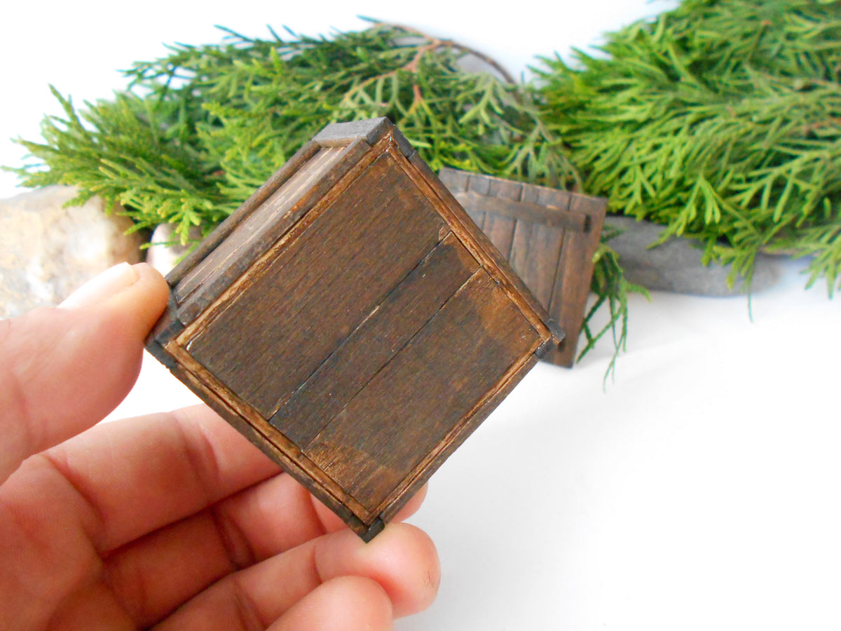 This is a miniature transporting box coffer that is approximately 1/12 in scale. The box coffer I have crafted from reclaimed beech wood popsicle sticks that I saved from the landfill.