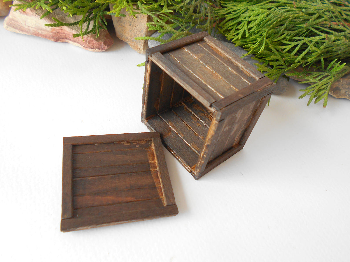 This is a miniature transporting box coffer that is approximately 1/12 in scale. The box coffer I have crafted from reclaimed beech wood popsicle sticks that I saved from the landfill.