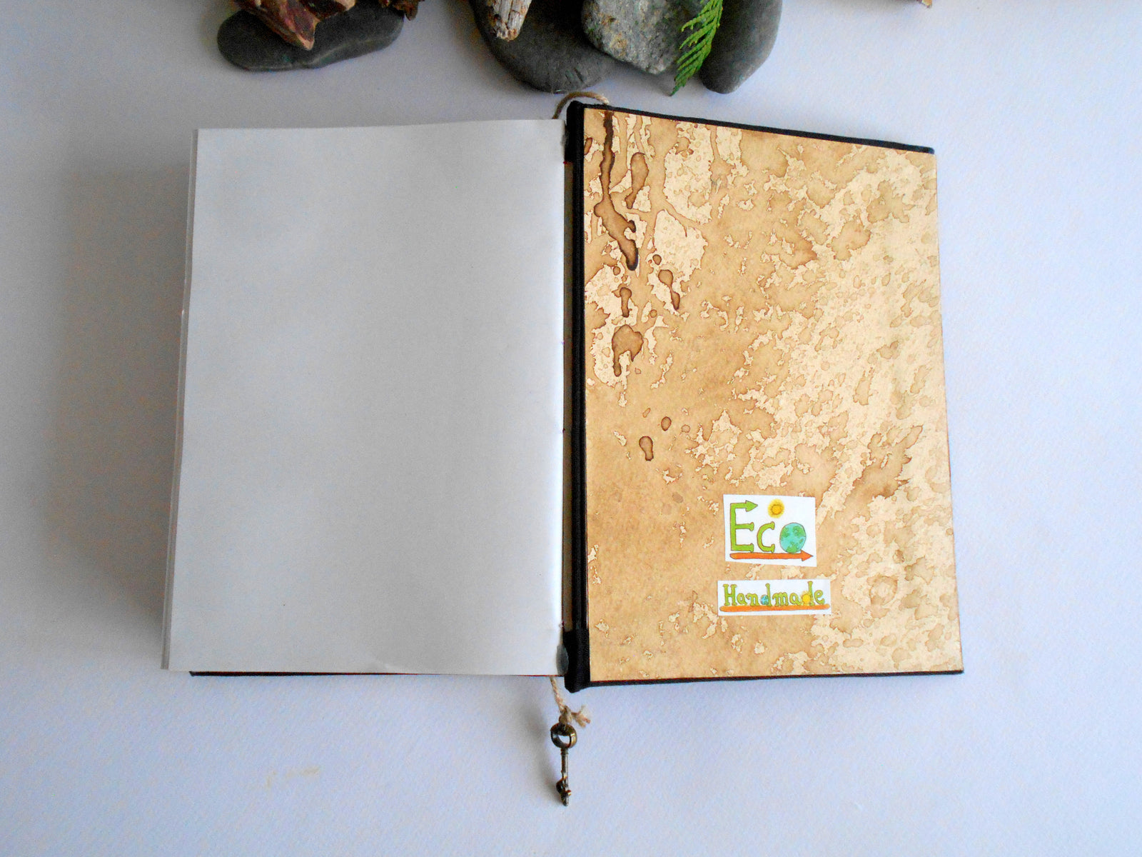 Handmade journal with a coffee stained inside cover and black linen fabric cover wrapping and with 100% recycled eco-friendly page sheets by ExiArts from Bulgaria.