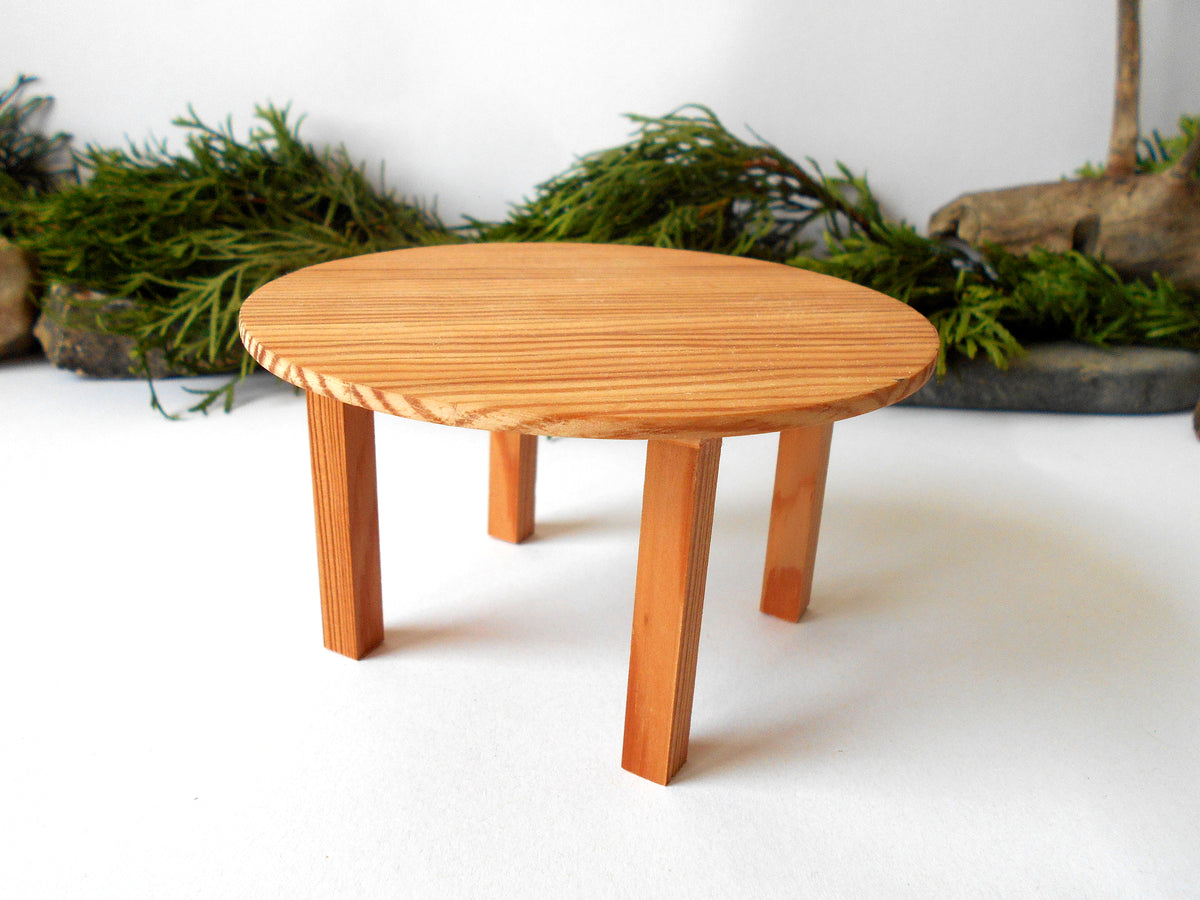 The height of the table is 2.5 inches and it is 4.5 inches diameter. This is 11.4 cm. diameter and 6.4 cm. height. This product listing is for one sush table.