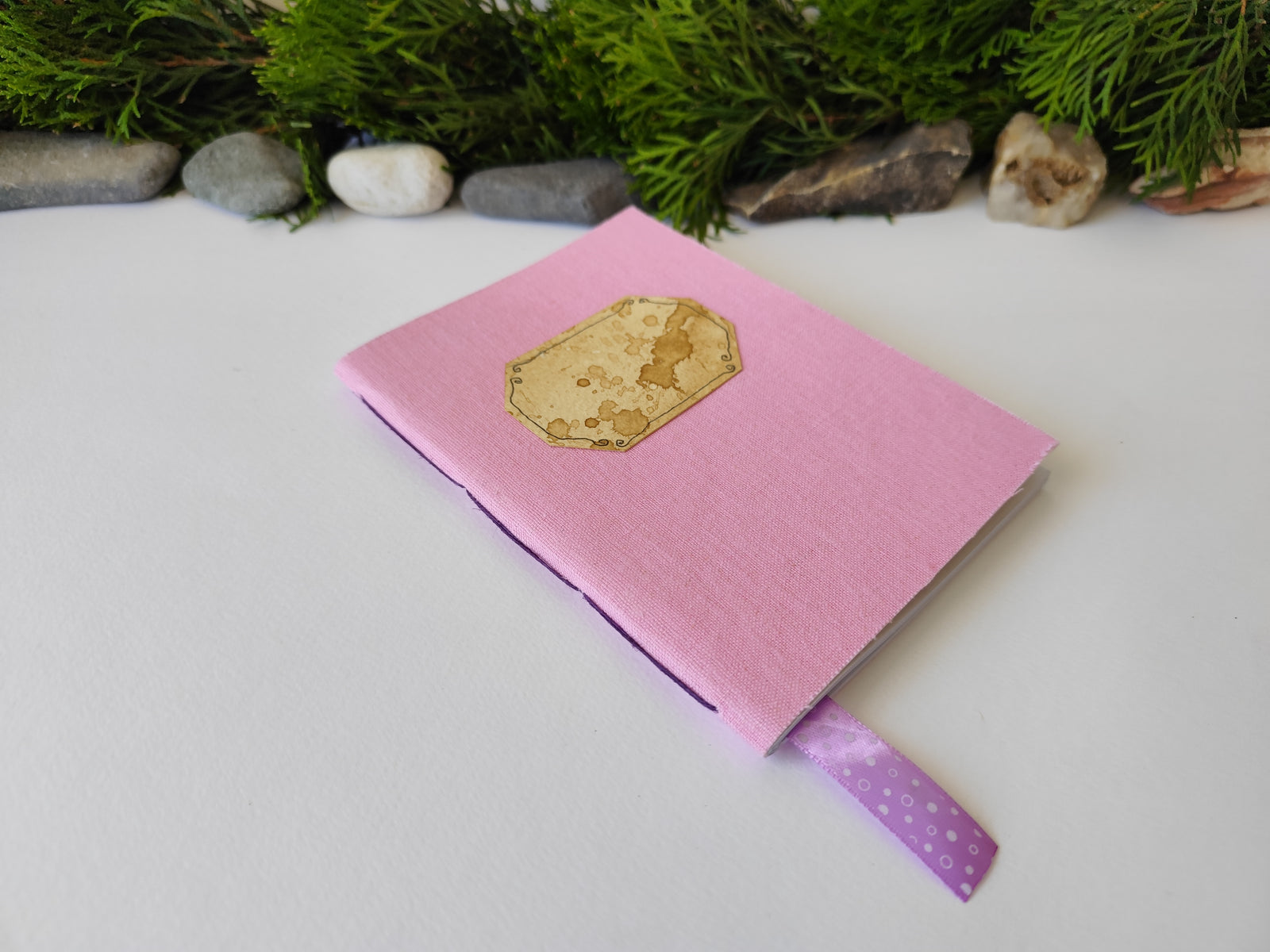 Pink handmade fabric notebook with a title label, a bookmark, Hemp Cord binding and coffee inside lining- 5" x 7" ( 12.5 x 17.5 cm. )