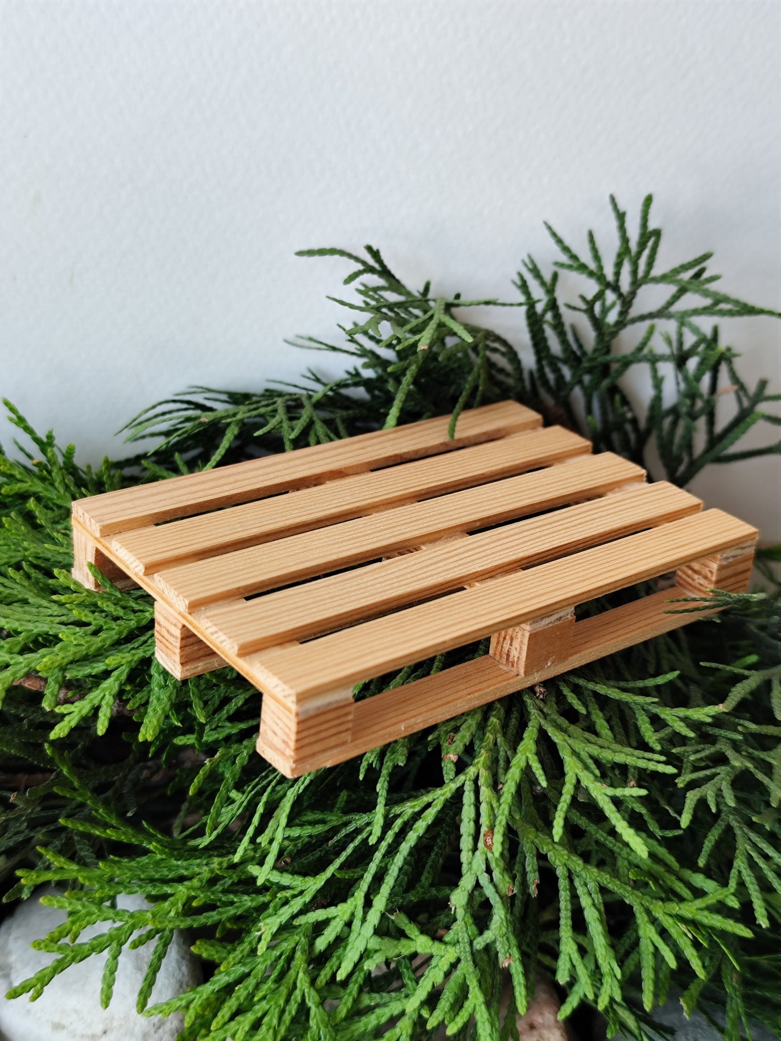 This is a handmade mini euro pallet coaster in 1/12 scale. It is crafted with real pine wood boards and beams and eco-friendly glue. Its size is 9.5 x 9.5 x 1.5 cm which is 3.3' x 3.3' x 0.5' inches. This is a listing to order 1 ( one ) mini euro pallet.
I made it to be mainly dollhouse accessories but it is also a coaster for your hot cups- you choose yourself for what to use it but I like crafting miniatures and this is my first miniature pallet design.
