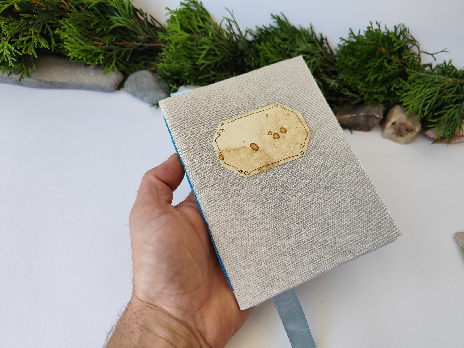 A gray handmade fabric notebook with a title label, a bookmark, Hemp Cord binding and coffee inside lining. The notebook is eco-friendly with linen gray fabric and Hemp cord as well as 100% recycled off-white blank pages.

NOTE: this is a listing for one notebook and shipping is included in the price.

Size: 5" x 7" ( 12.5 x 17.5 cm. )

Page number: 50 sheets - 100 pages

Color: hray

Page paper: 100 % recycled, off-white and blank pages