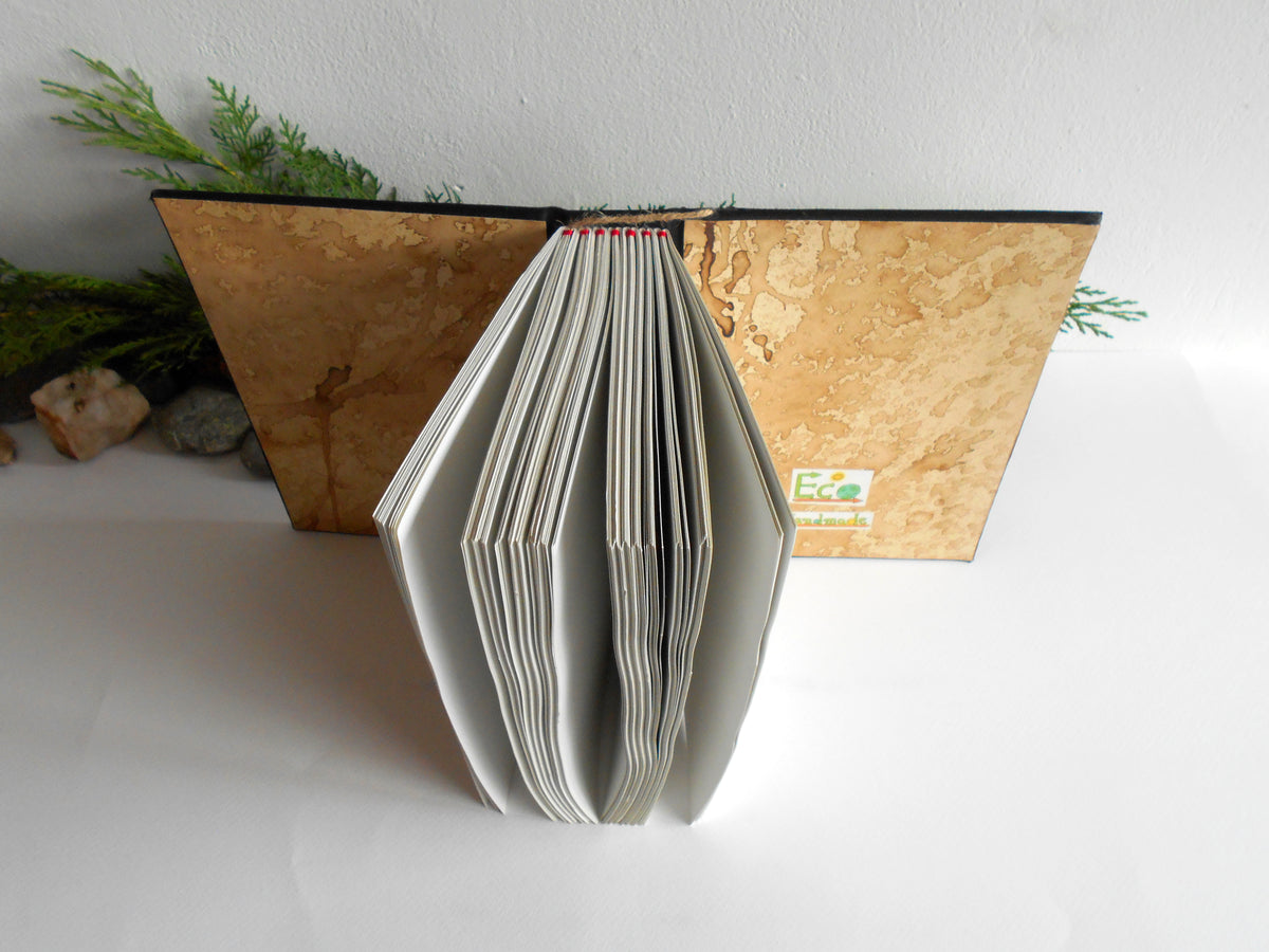 Handmade black fabric journal with 100% recycled pages and art