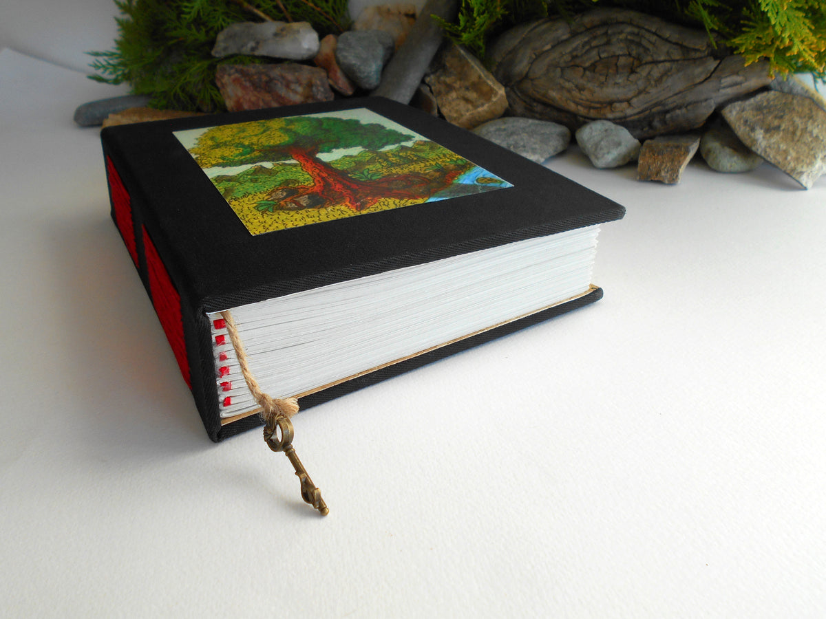 Handmade black fabric journal with 100% recycled pages and art