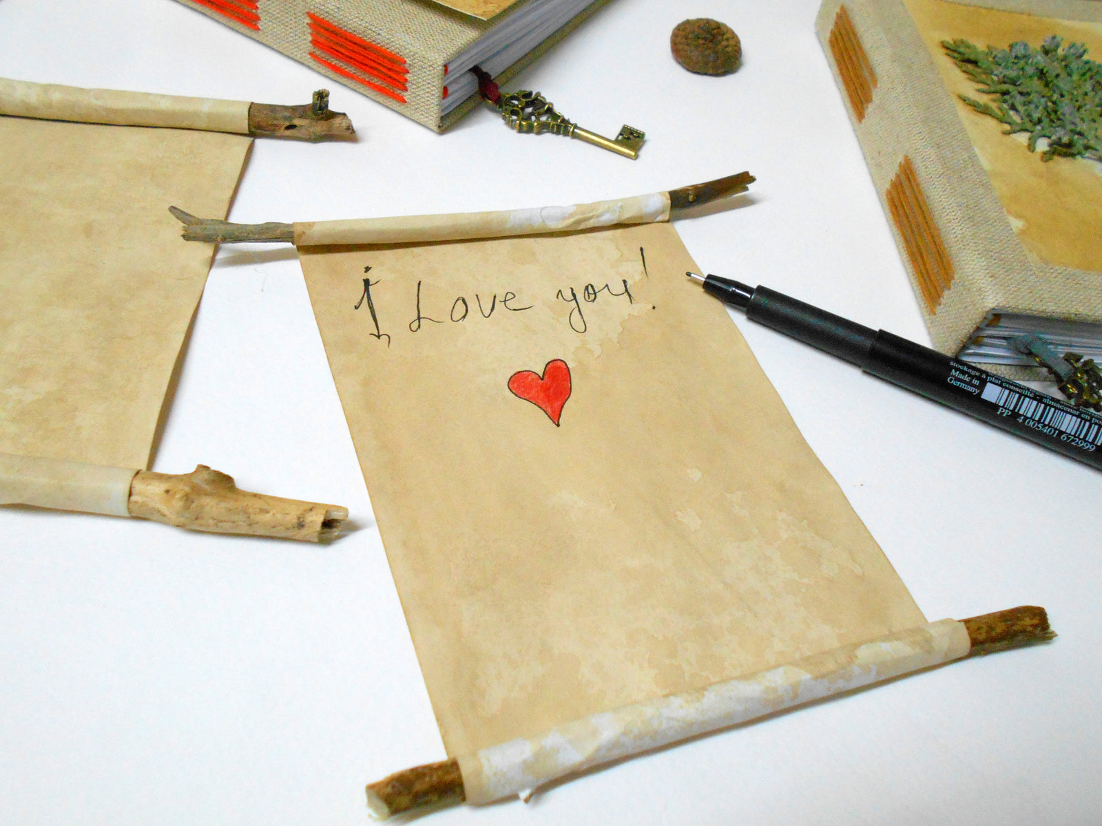 Handmade blank paper scrolls with coffee recycled papers and hand-drawn templates on the edges